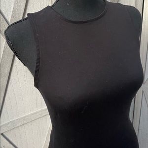 Black midi dress with a slit on each size medium. Purchased from Amazon.